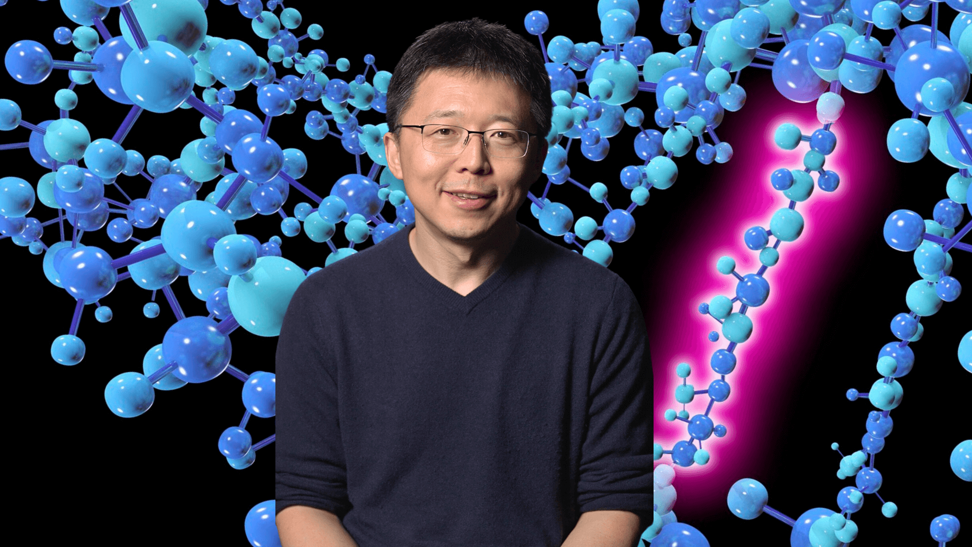 Feng Zhang in front of a DNA model