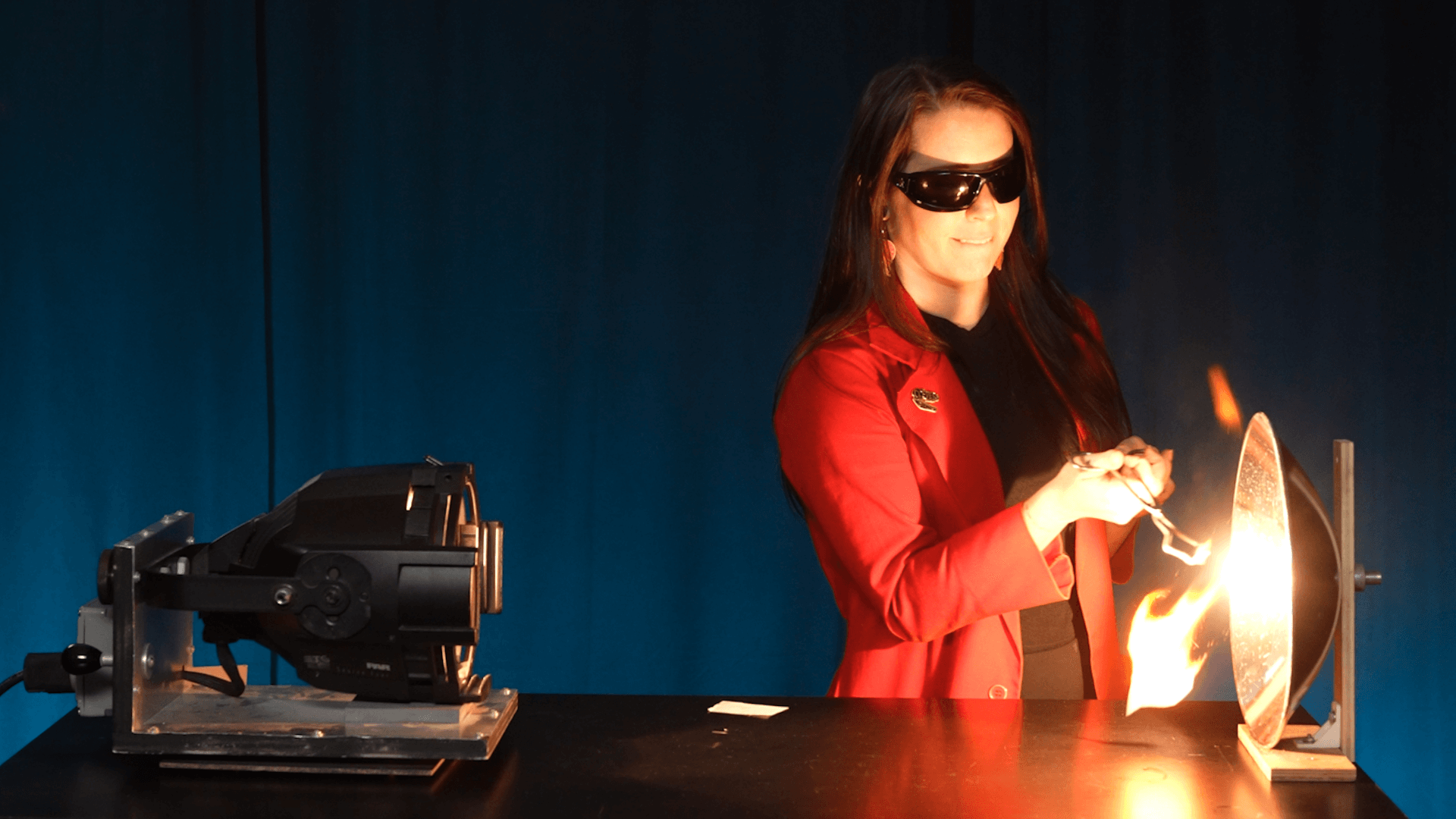 Educator Lauren burns paper using light