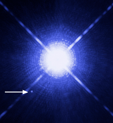The bright star in this image is the Sirius. The arrow points out its companion, Sirius B, the closest white dwarf to Earth at roughly 8.6 light years away. Credit: NASA/ESA/H. Bond and M. Barstow