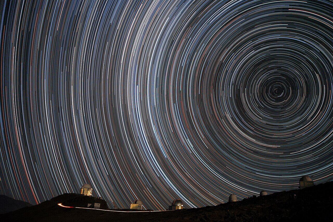 An image of star trails created by taking an extended exposure of the night sky. The extended exposure shows the effect of Earth’s rotation on the sky. Credit: ESO/A. Santerne