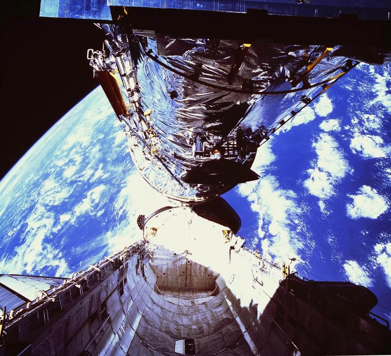 Hubble is lifted out of the cargo bay of the Space Shuttle Discovery during its deployment. Credit: NASA