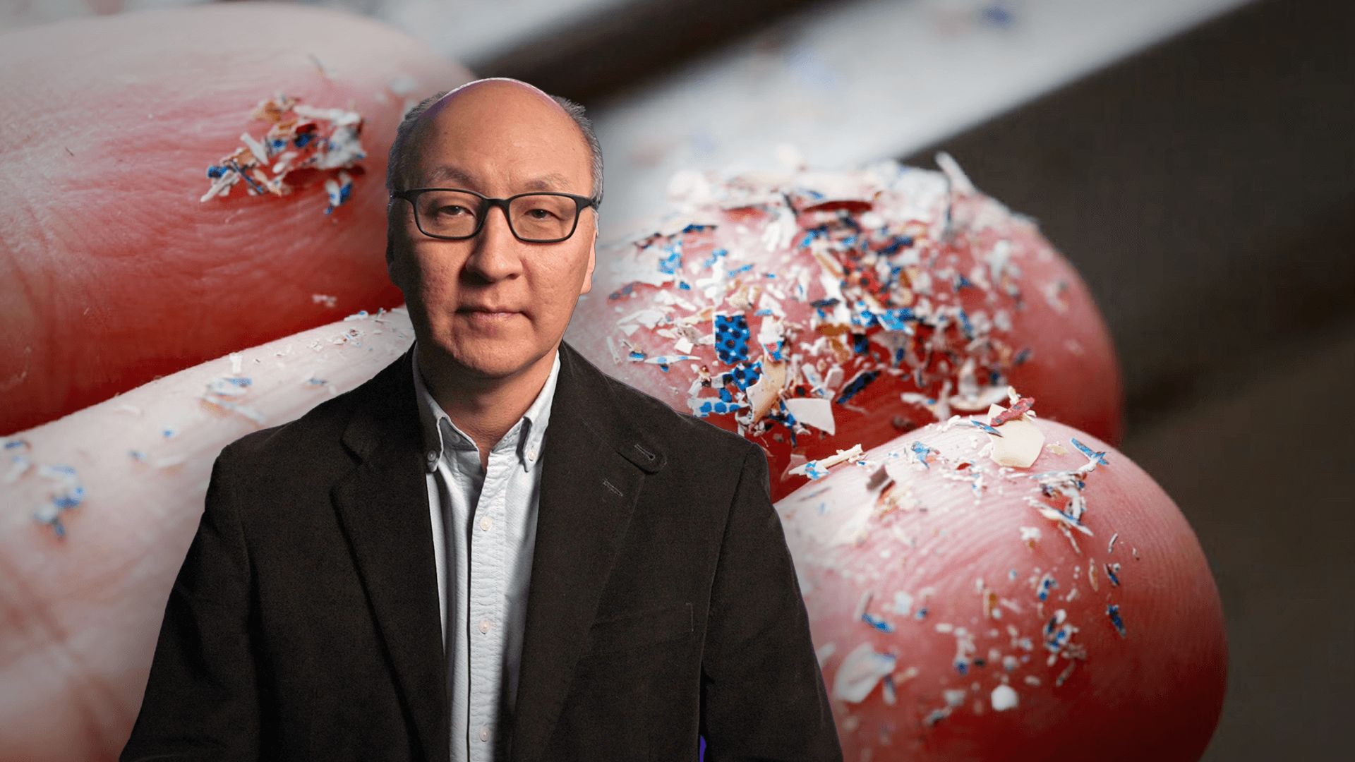 Insoo Hyun in front of a hand with microplastics on the fingers
