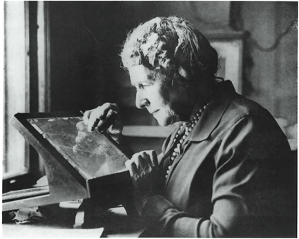 Annie Jump Cannon examines an image