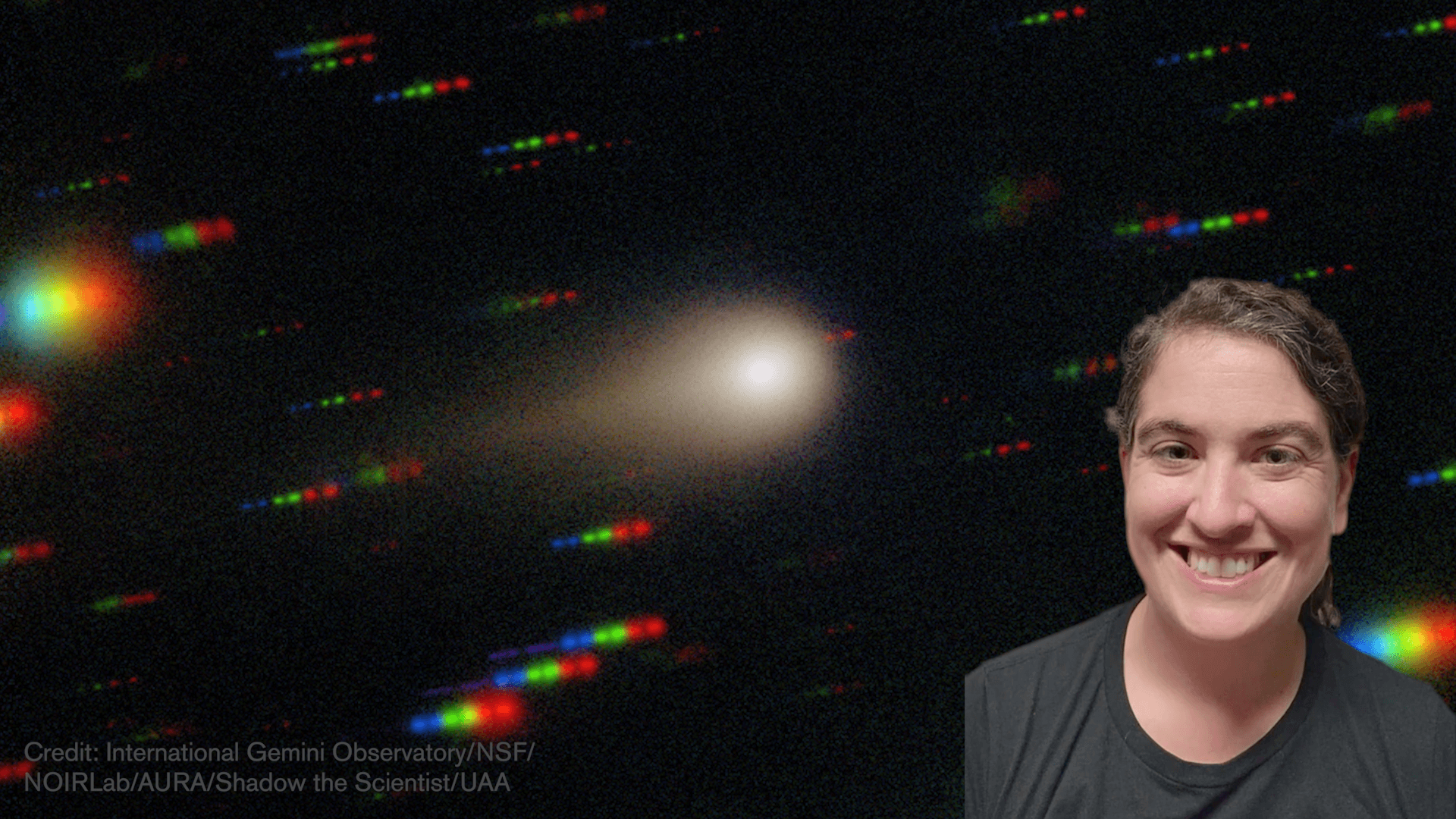 Talia smiling in front of a photo of Comet 3i Atlas