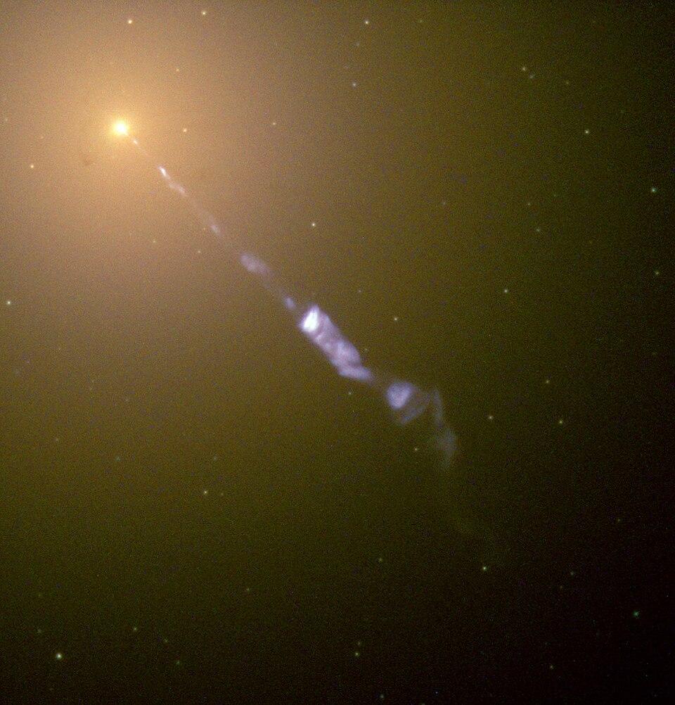 The SMBH at the heart of M87 is emitting a jet as seen in this Hubble image. Credit: ESA/NASA