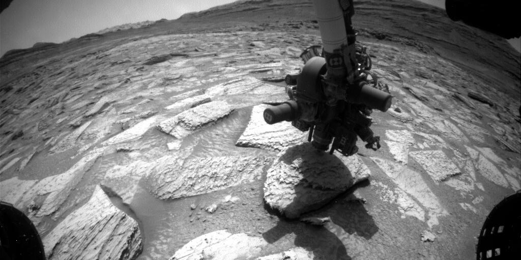 This image from Curiosity’s front HazardCam shows the moment Atacama first left the ground attached to the drill bit. Credit: NASA/JPL-Caltech