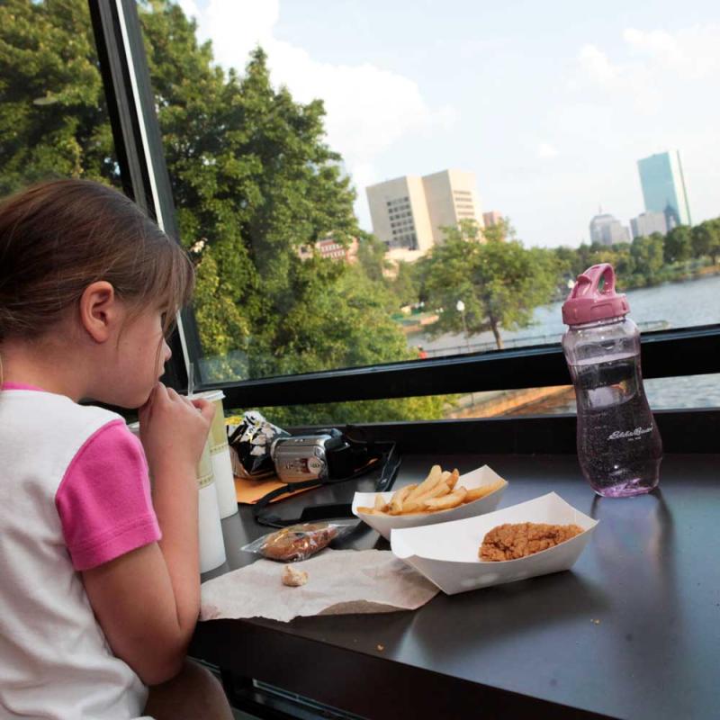 A young girl eating lunch at the Riverview Café.