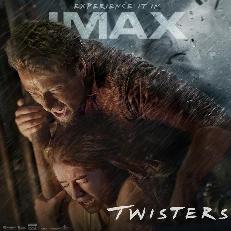 Two people hug each other tightly inside a tornado.
