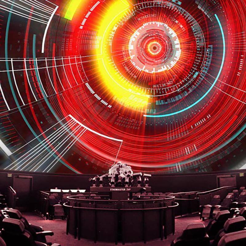 Circular patterns in red, yellow, white and black, projected onto the Planetarium dome.