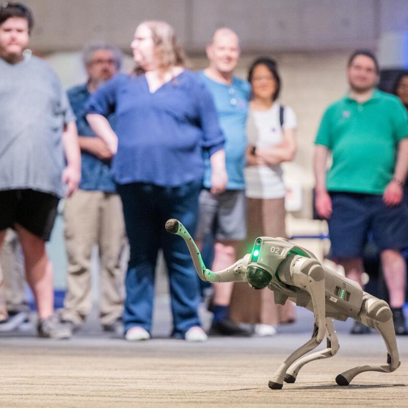 A robot waves to Museum visitors
